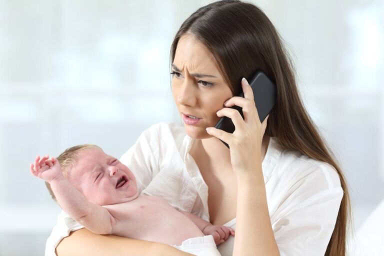 A phone holding a baby, and on the phone