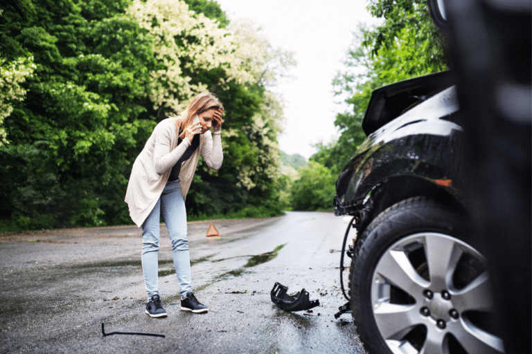 Woman on phone after car accident