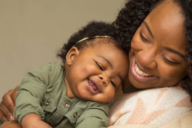 A woman and her happy baby