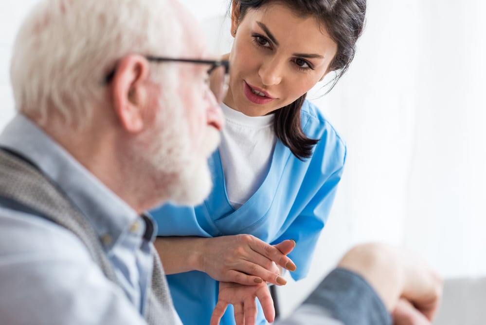 A nurse and a senior patient