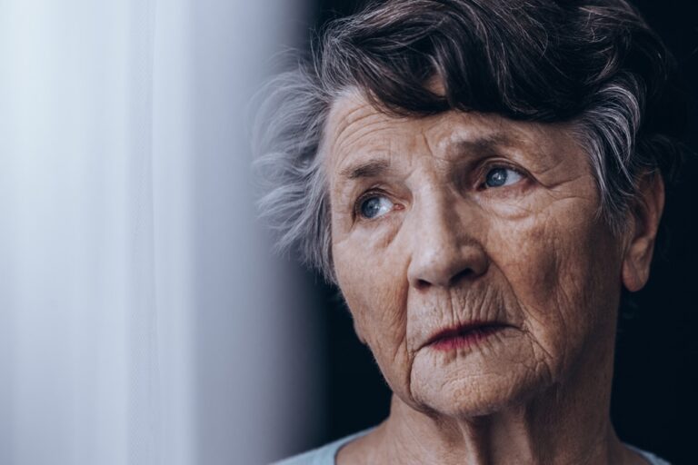 Elderly woman experiencing anxiety.