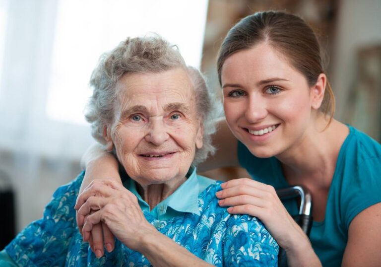 A happy senior and a young lady