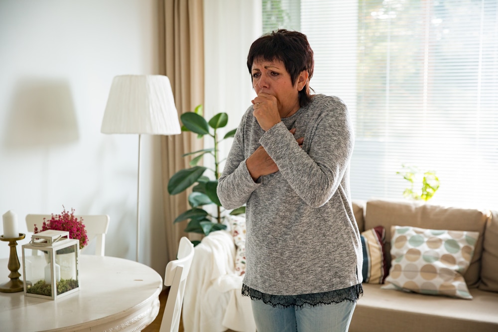 A senior coughing