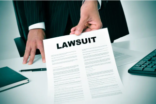a man holding a lawsuit document