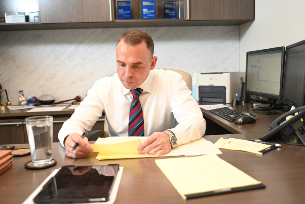 Michael F. Bonamarte, IV working at desk