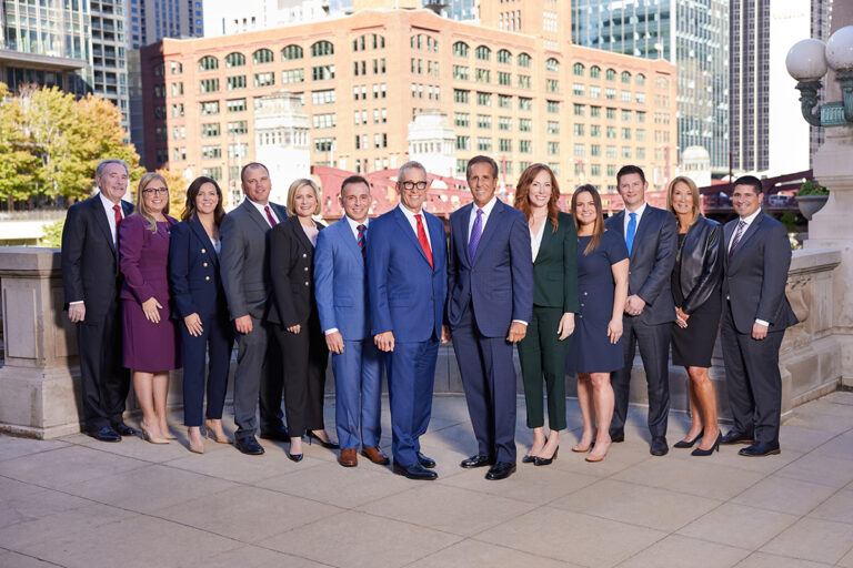 Partners at Levin & Perconti with backdrop of downtown Chicago