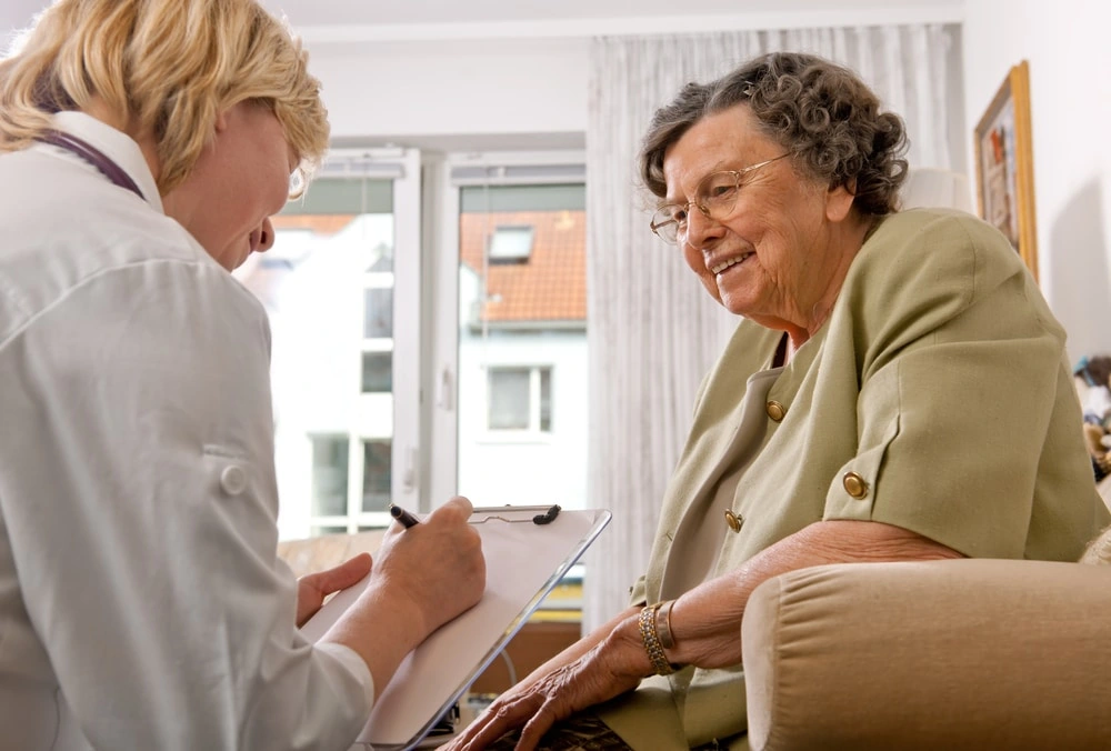 Elderly woman speaking with long term obudusman
