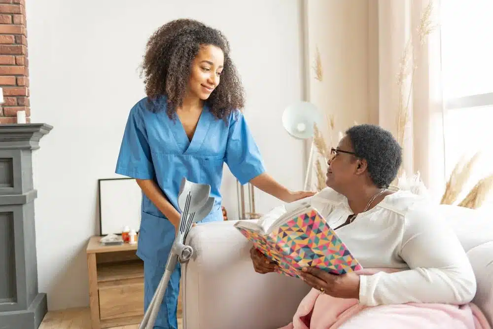 nursing home staff speaking to a patient