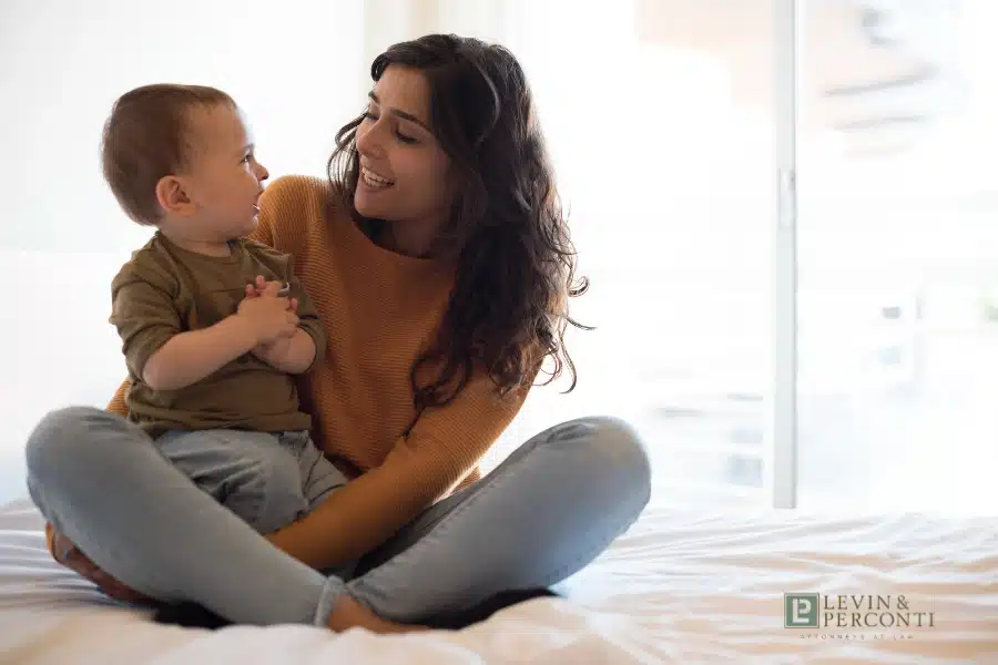 Hispanic mother interacting with infant