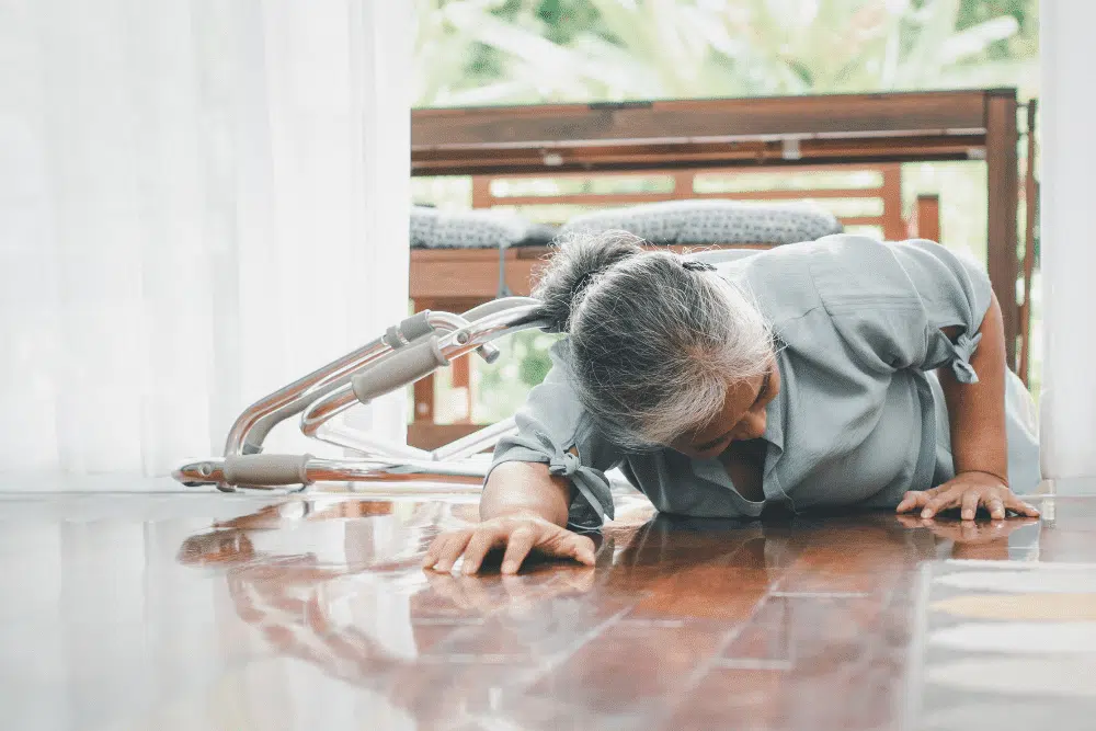 Elderly woman than less and looks like she cannot get back up