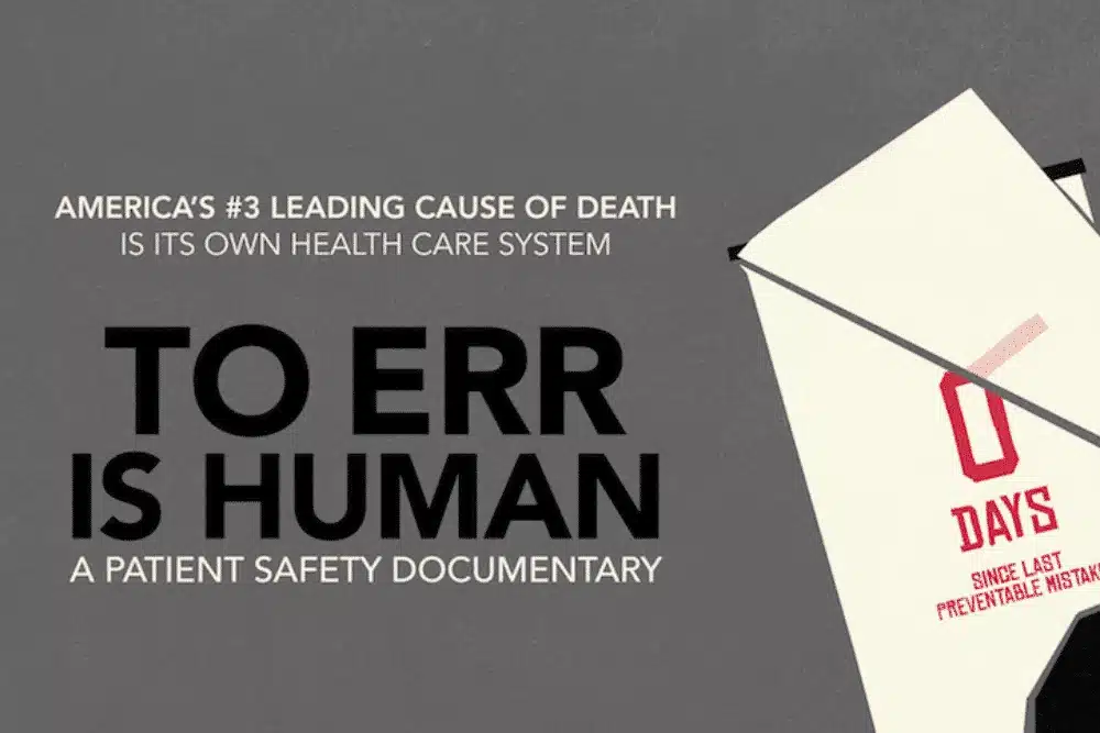A graphics with an inscription, "To Err is Human"