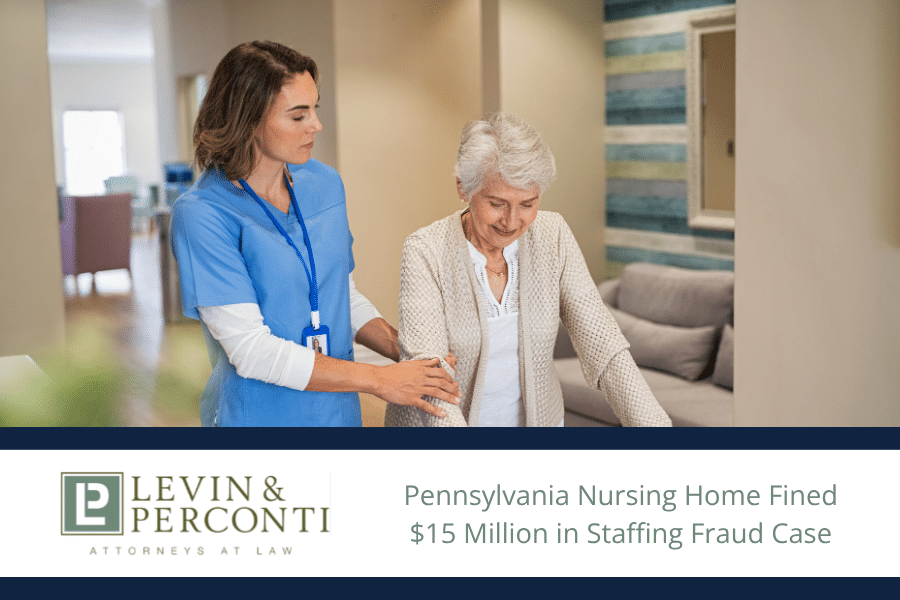 Nursing home staff helping a resident walk down the hall