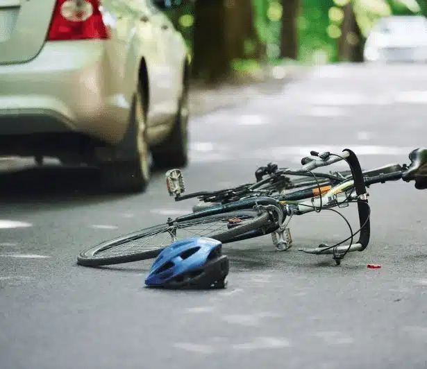 a bicycle on the ground after a collision.