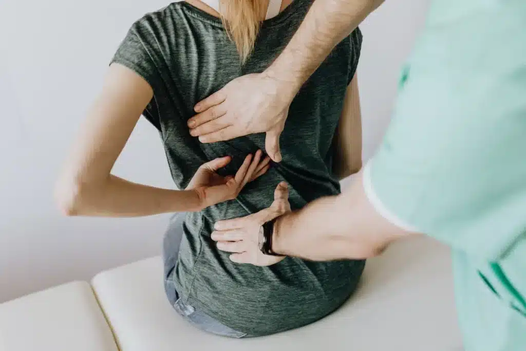 Chiropractor adjusting woman's back