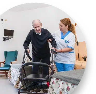 Elderly man receiving assistance in nursing home