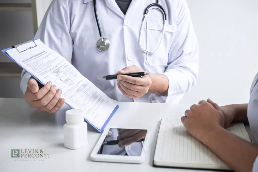 doctor showing a form to a patient