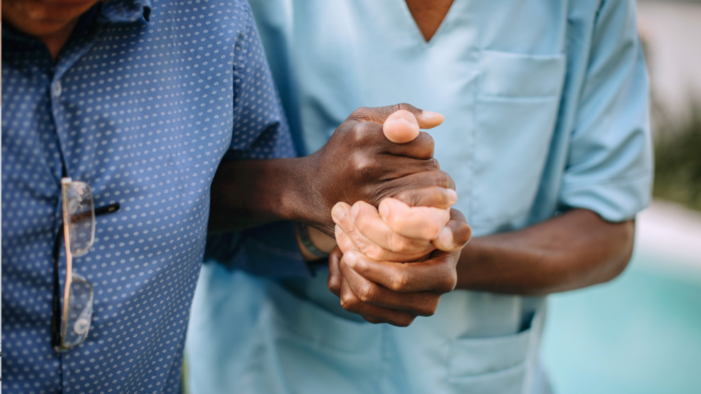 a nurse helping a resident at a nursing home