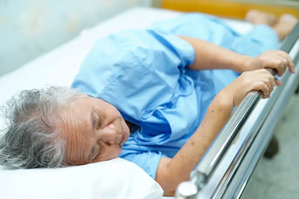 Elderly patient resting in a hospital bed