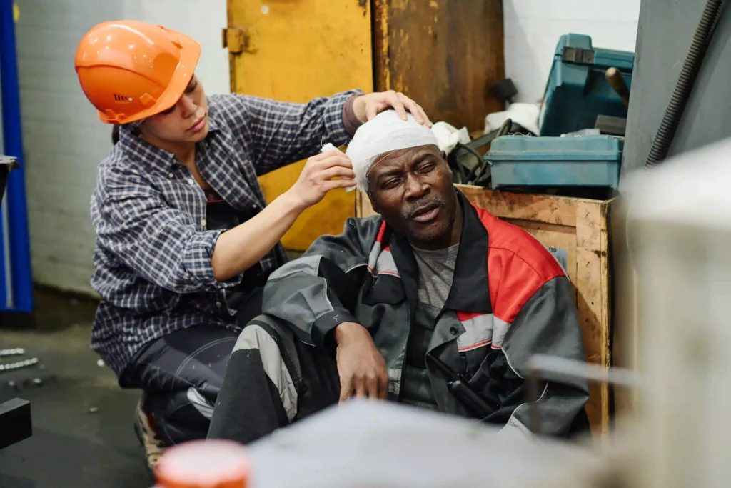 assisting-injured-colleague-in-industrial-setting