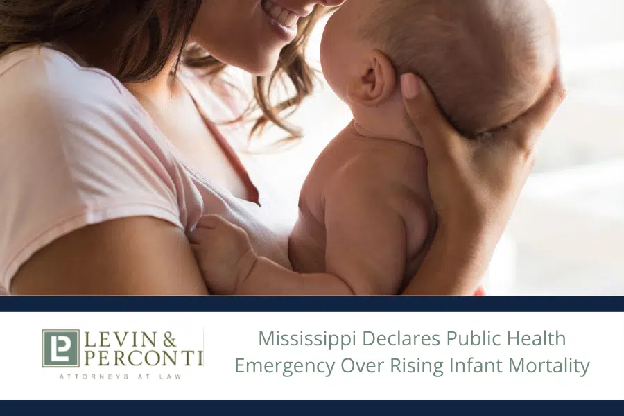 Mom holding newborn baby close and smiling with headline text "Mississippi Declares Public Health Emergency Over Rising Infant Mortality"