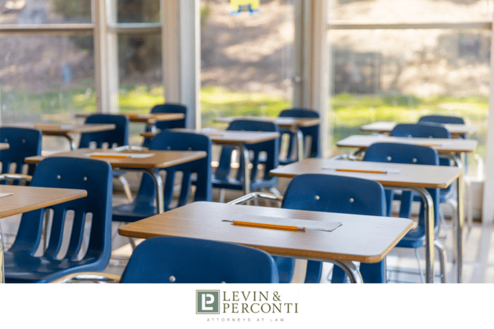 Empty classroom with student desks and chairs arranged in rows