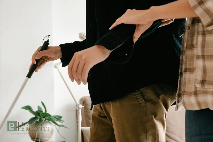 A man with visual impairment/accessibility in a CILA home