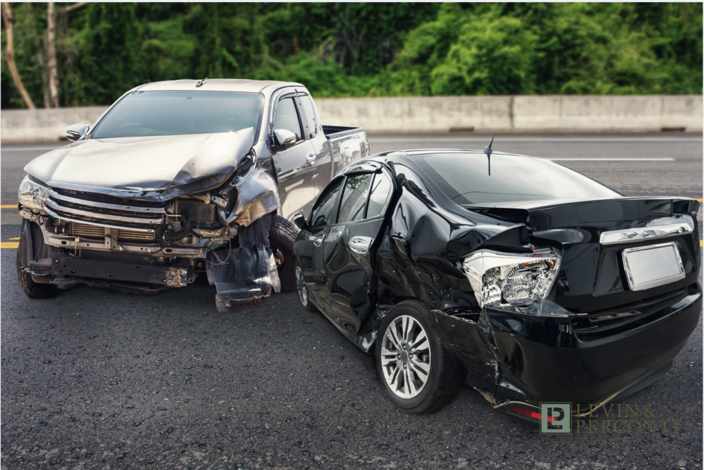 two cars severely damaged in a head-on collision