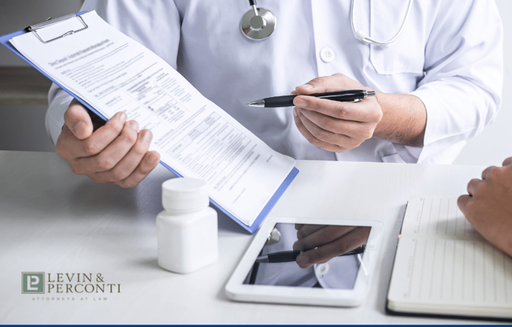 doctor showing a form to a patient