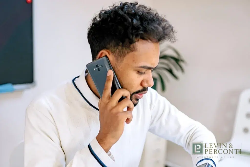 client talking on the phone about switching attorneys