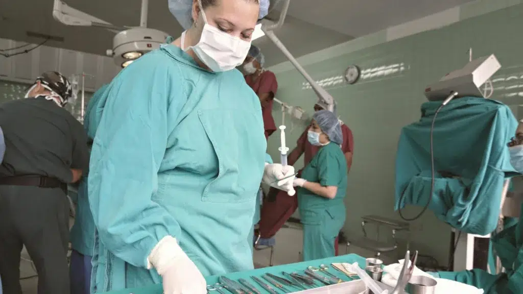 Surgeon preparing instruments in an operating room before surgery