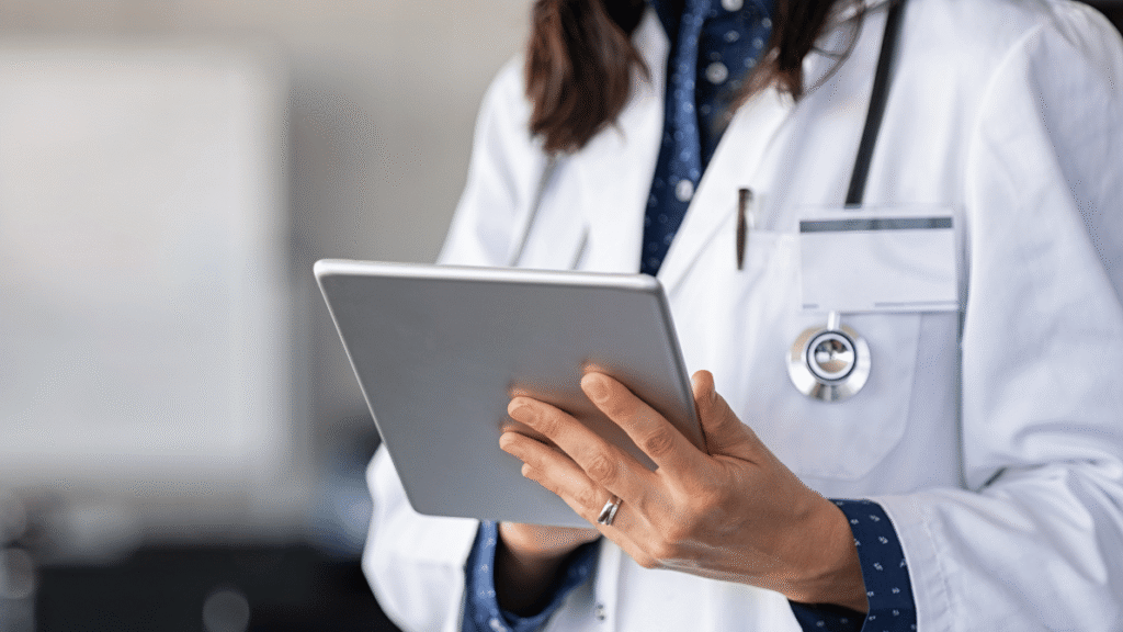 a doctor writing patient notes after a procedure