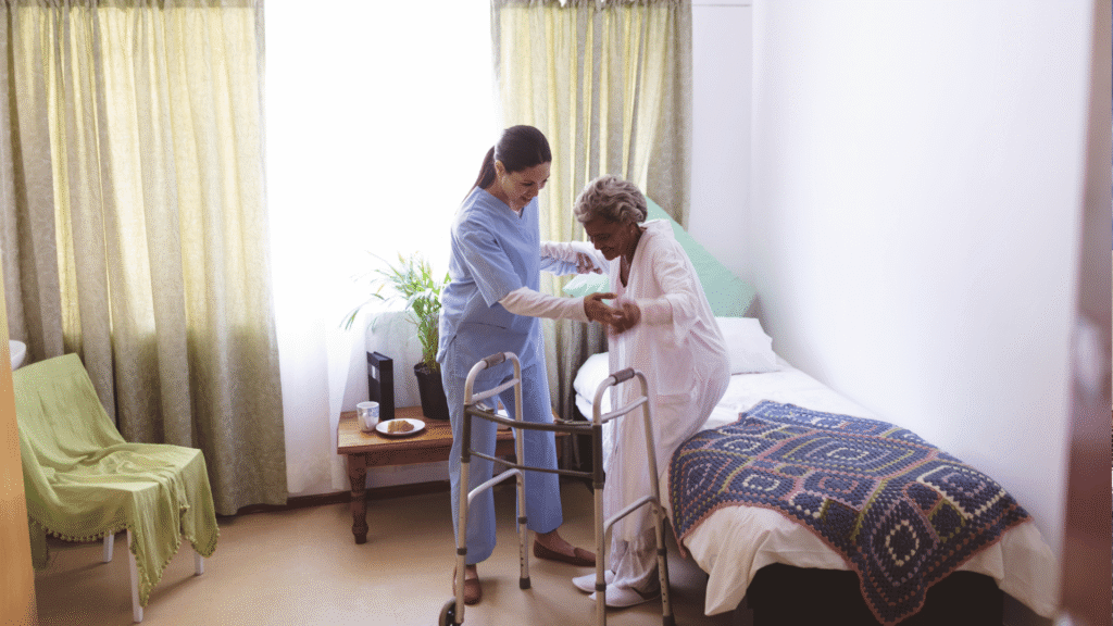 a nurse helping a resident get out of bed