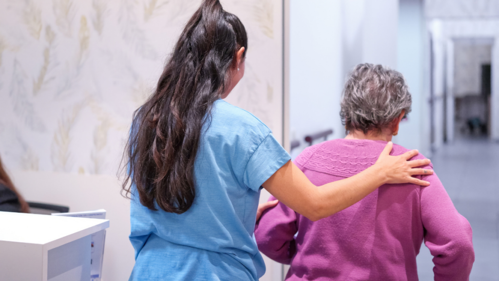 a nurse helping a resident at a nursing home