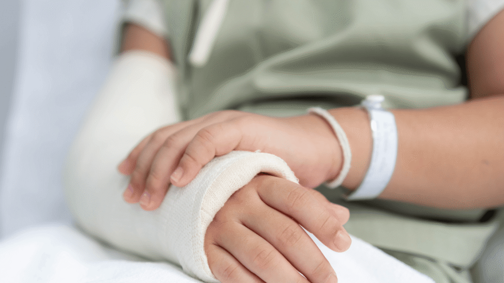 a woman sitting in an emergency room after a catastrophic injury